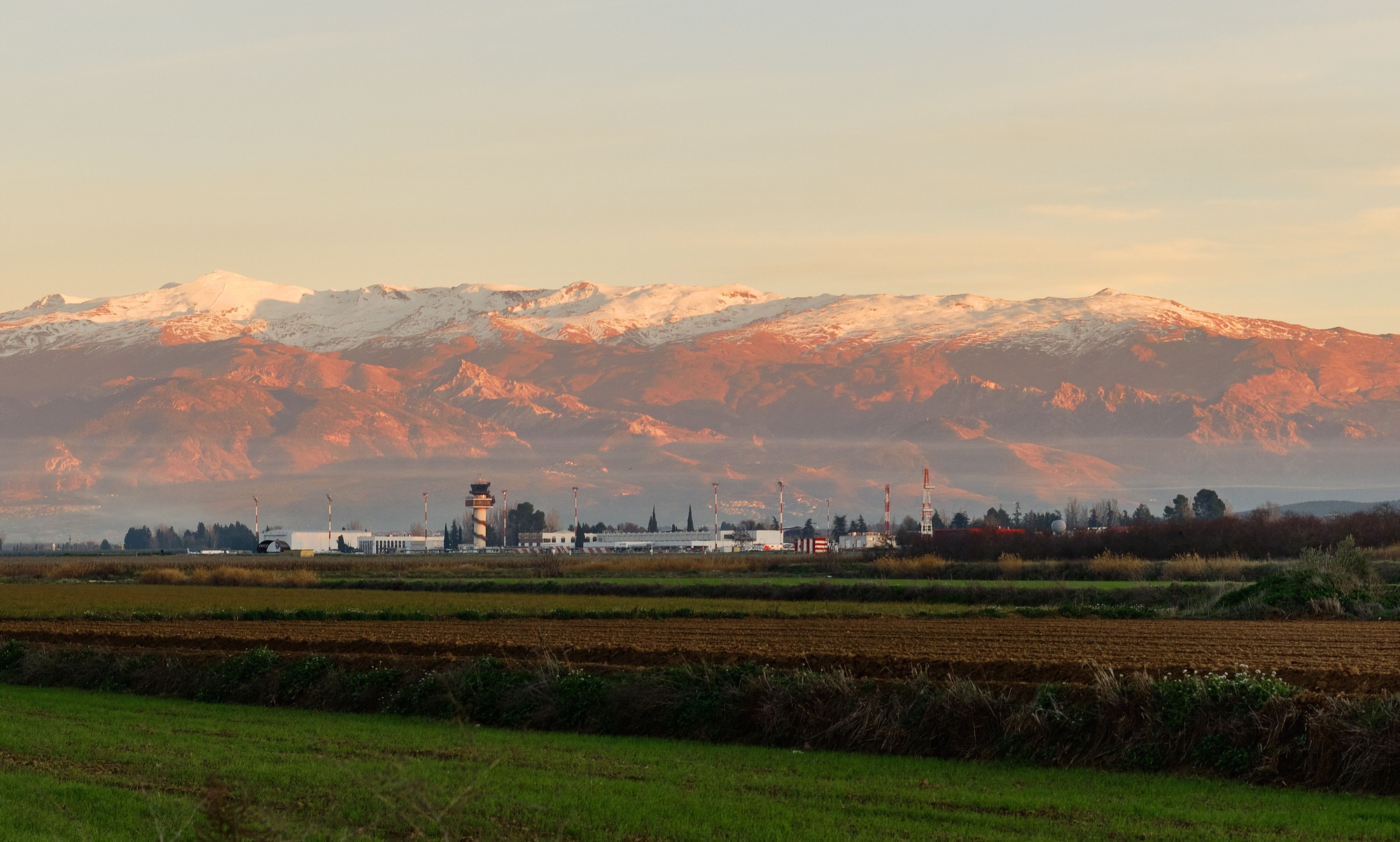 Beautiful shot of a pink sunset sky over the Granada Airport in Andalusia, Spain